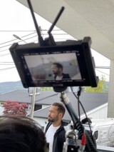 Behind camera Behind camera